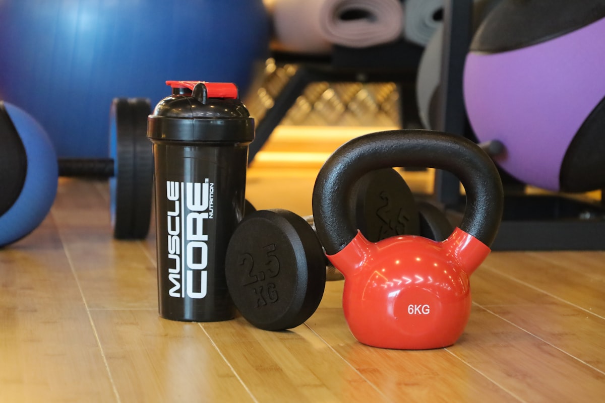 Athlete recovering with hydration beverage after intense workout